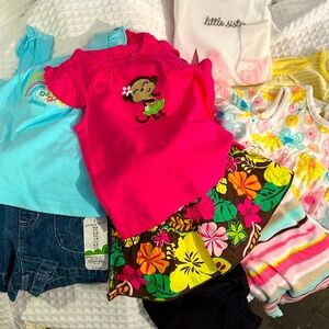 Shirts ,onesies, pants and shorts 3-9 months in size all new most with tags